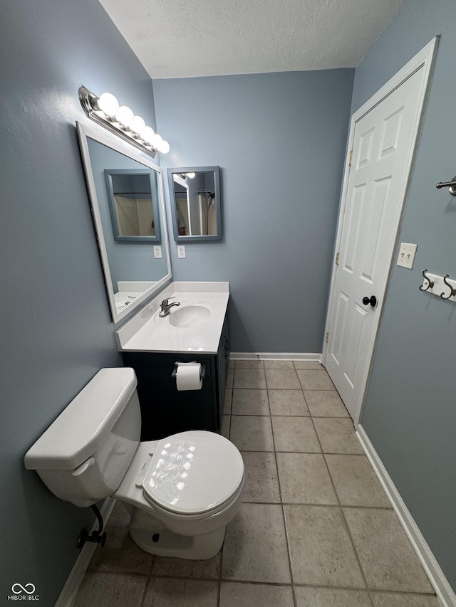 1206 Brownswood Dr, Brownsburg, IN 46112 - bathroom featuring vanity, a textured ceiling, and tile patterned floors