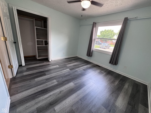 1206 Brownswood Dr, Brownsburg, IN 46112 - unfurnished bedroom with a textured ceiling, dark wood-type flooring, ceiling fan, and a closet