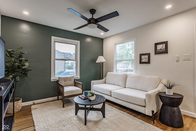1710 N Irvington Ave, Indianapolis, IN 46218 - living area featuring wood finished floors, a ceiling fan, and recessed lighting