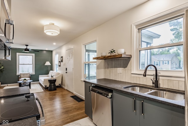 1710 N Irvington Ave, Indianapolis, IN 46218 - kitchen with dishwasher, electric range, dark countertops, and healthy amount of natural light