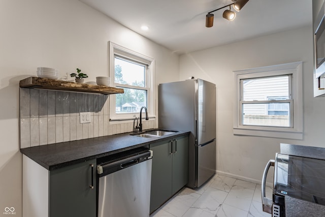 1710 N Irvington Ave, Indianapolis, IN 46218 - kitchen with stainless steel appliances, dark countertops, light marble finish flooring, decorative backsplash, and open shelves