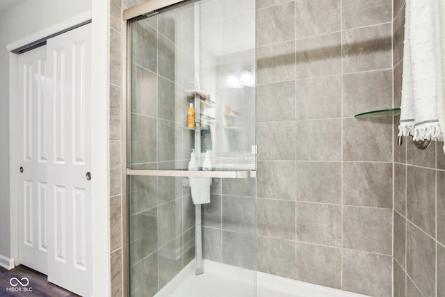 9916 Gallop Ln, Fishers, IN 46040 - bathroom with a shower stall and wood finished floors