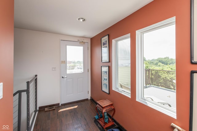 1036 Jackson St, Columbus, IN 47201 - doorway to outside with dark wood-style floors and baseboards
