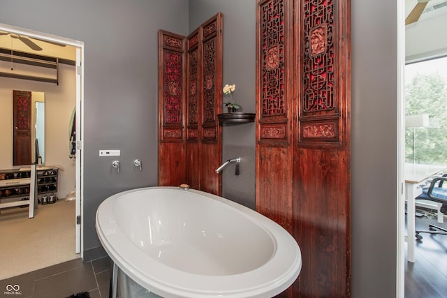 1036 Jackson St, Columbus, IN 47201 - bathroom with a freestanding tub and a ceiling fan