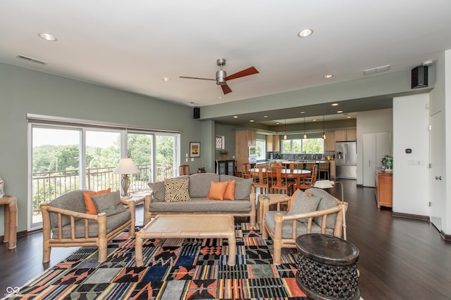 1036 Jackson St, Columbus, IN 47201 - living room with dark wood-type flooring, ceiling fan, healthy amount of natural light, and recessed lighting