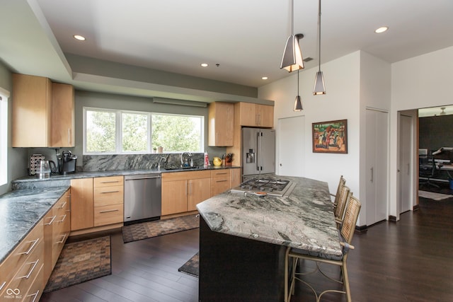 1036 Jackson St, Columbus, IN 47201 - kitchen featuring stainless steel appliances, dark wood-style flooring, light brown cabinets, dark stone countertops, and recessed lighting