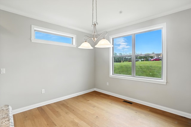 1127 Kay Dr, Greenwood, IN 46142 - empty room with plenty of natural light, light wood-type flooring, and crown molding