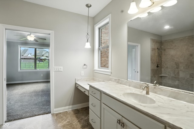 1127 Kay Dr, Greenwood, IN 46142 - full bath featuring vanity, tiled shower, and a ceiling fan