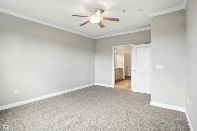 1127 Kay Dr, Greenwood, IN 46142 - spare room featuring ceiling fan, light carpet, crown molding, and a smoke detector