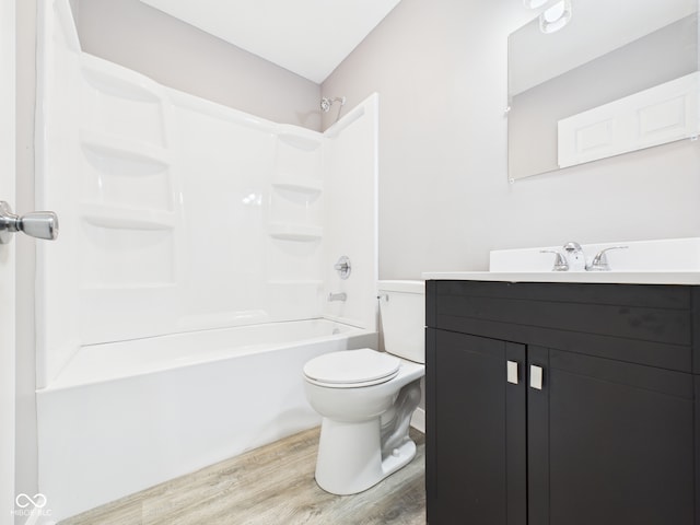 602 W 34th St, Anderson, IN 46013 - full bathroom featuring vanity, wood finished floors, and bathing tub / shower combination
