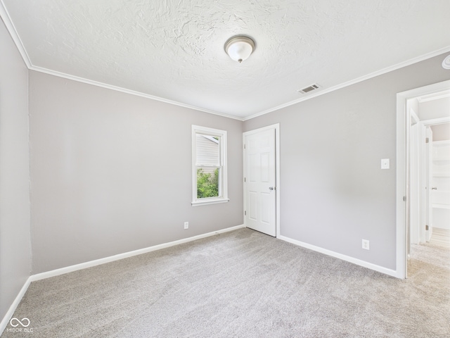 602 W 34th St, Anderson, IN 46013 - unfurnished room with crown molding, carpet, and a textured ceiling