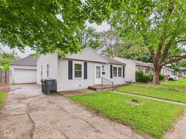 602 W 34th St, Anderson, IN 46013 - view of front facade featuring concrete driveway, a garage, roof with shingles, and an outdoor structure