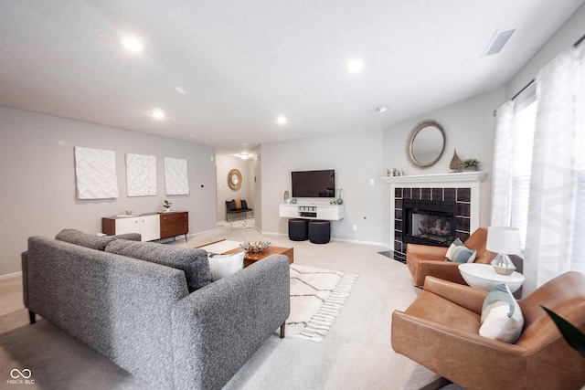 14459 Forsythia Ln, Fishers, IN 46038 - living area with recessed lighting, a tile fireplace, and light carpet