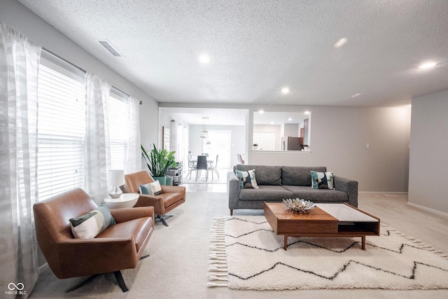 14459 Forsythia Ln, Fishers, IN 46038 - living area with a textured ceiling, recessed lighting, and carpet
