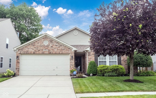 14459 Forsythia Ln, Fishers, IN 46038 - view of front facade with an attached garage, driveway, brick siding, and a front yard