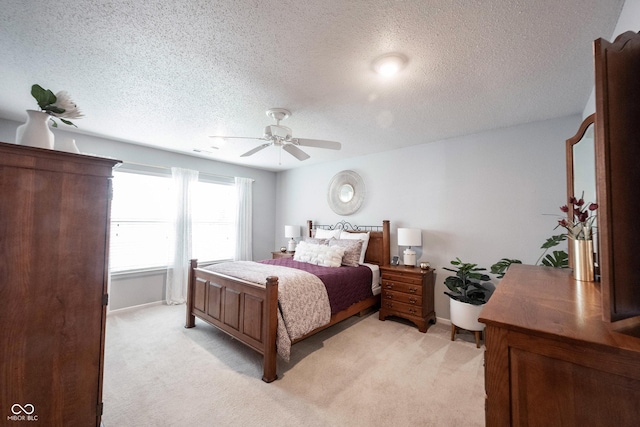 14459 Forsythia Ln, Fishers, IN 46038 - bedroom featuring light colored carpet, a textured ceiling, and ceiling fan