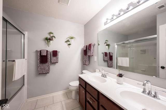 14459 Forsythia Ln, Fishers, IN 46038 - bathroom with double vanity, tile patterned floors, and enclosed tub / shower combo
