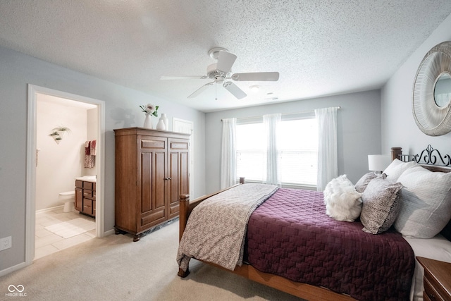14459 Forsythia Ln, Fishers, IN 46038 - bedroom featuring a textured ceiling, light carpet, ensuite bath, and ceiling fan