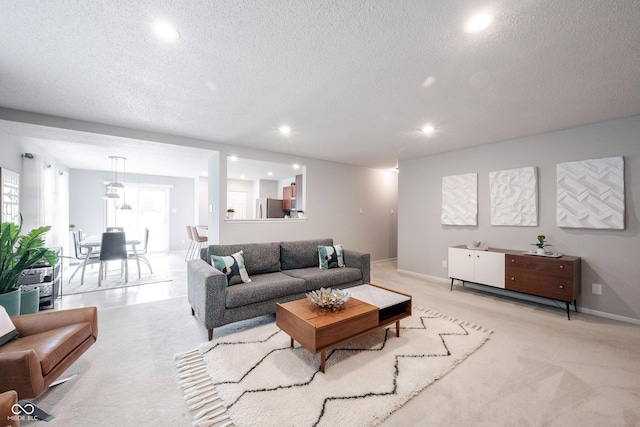 14459 Forsythia Ln, Fishers, IN 46038 - living area with recessed lighting, light carpet, and a textured ceiling