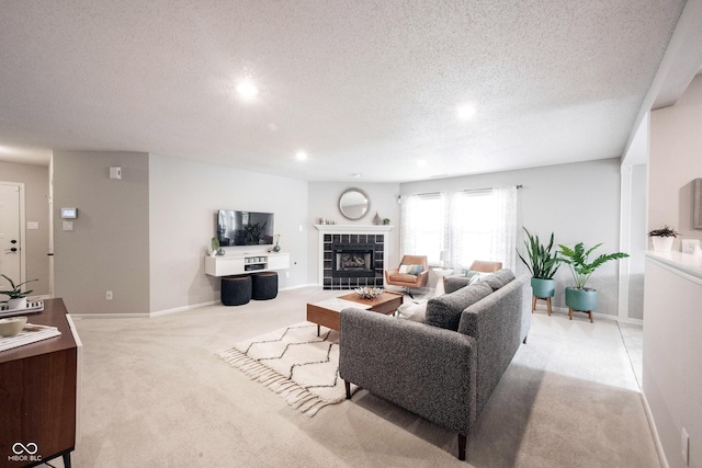 14459 Forsythia Ln, Fishers, IN 46038 - living area with light carpet, a textured ceiling, a fireplace, and recessed lighting