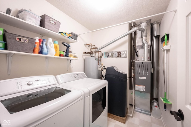 14459 Forsythia Ln, Fishers, IN 46038 - washroom with washing machine and dryer, light flooring, water heater, and a textured ceiling