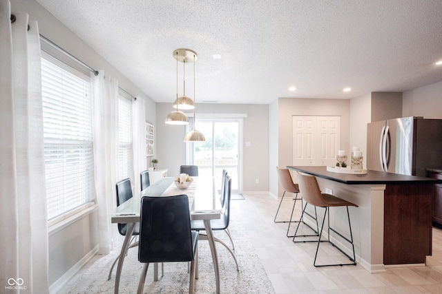 14459 Forsythia Ln, Fishers, IN 46038 - dining area featuring a textured ceiling, recessed lighting, and light floors