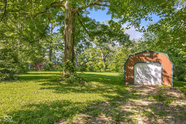 3370 E State Road 160, Salem, IN 47167 - view of grassy yard with an outbuilding, dirt driveway, and a garage