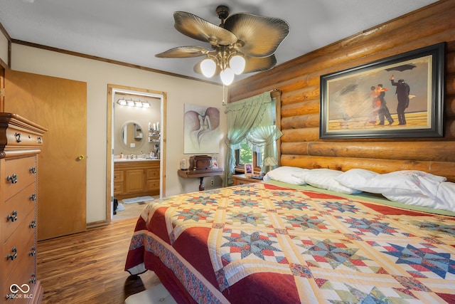 3370 E State Road 160, Salem, IN 47167 - bedroom featuring log walls, wood finished floors, connected bathroom, ornamental molding, and ceiling fan