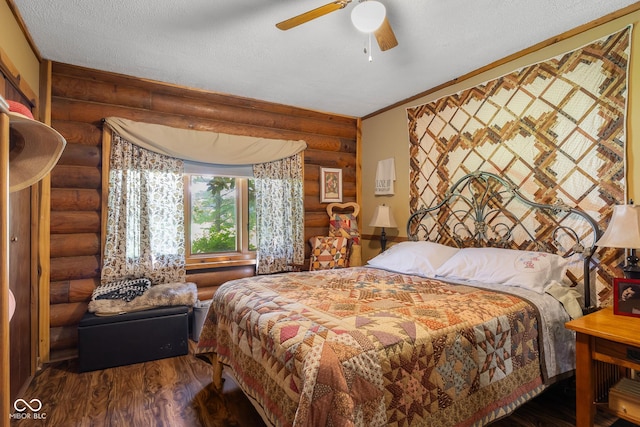 3370 E State Road 160, Salem, IN 47167 - bedroom featuring log walls, wood finished floors, and a ceiling fan