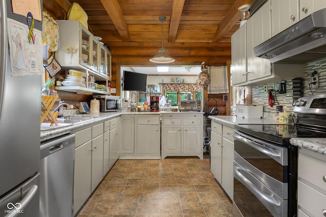 3370 E State Road 160, Salem, IN 47167 - kitchen with appliances with stainless steel finishes, under cabinet range hood, a wood ceiling with exposed beams, light countertops, and stone finish floors