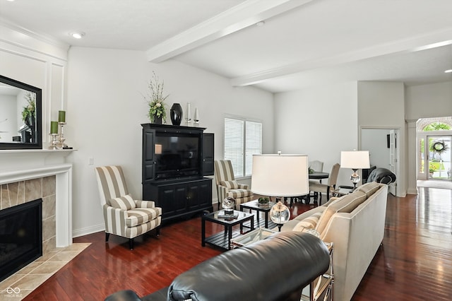 6570 Freemont Ln, Carmel, IN 46033 - living area with wood finished floors, a tile fireplace, beamed ceiling, and recessed lighting