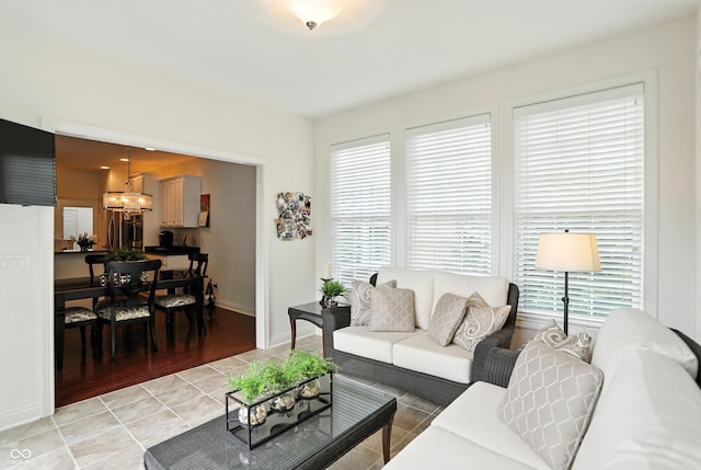 6570 Freemont Ln, Carmel, IN 46033 - living area featuring a chandelier and light tile patterned flooring