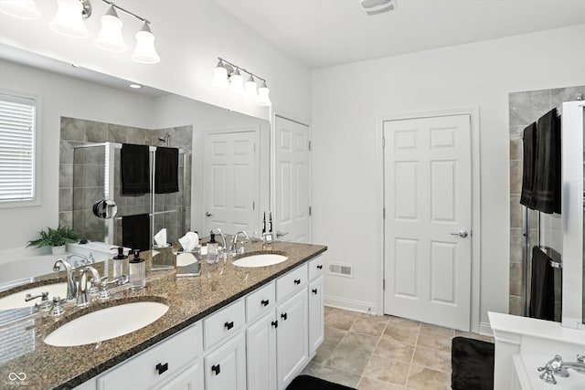 6570 Freemont Ln, Carmel, IN 46033 - full bath featuring double vanity, a shower stall, and a garden tub