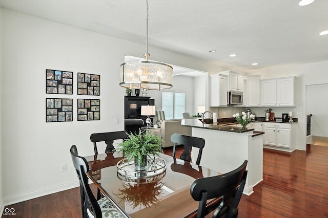 6570 Freemont Ln, Carmel, IN 46033 - dining room with recessed lighting, dark wood finished floors, and a chandelier