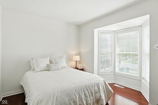 6570 Freemont Ln, Carmel, IN 46033 - bedroom featuring baseboards and wood-type flooring
