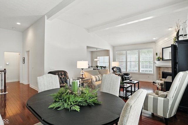 6570 Freemont Ln, Carmel, IN 46033 - dining room with dark wood-type flooring, a tile fireplace, and recessed lighting