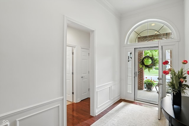 6570 Freemont Ln, Carmel, IN 46033 - foyer entrance with wood finished floors, crown molding, wainscoting, and a decorative wall