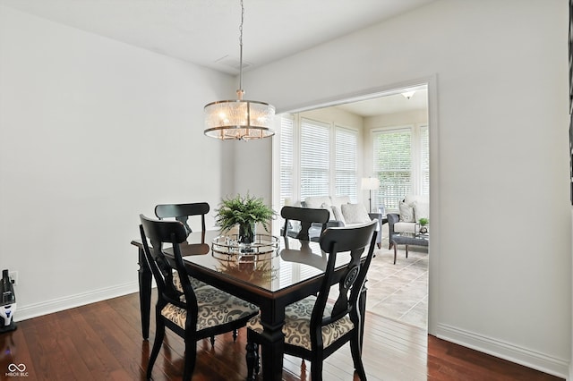 6570 Freemont Ln, Carmel, IN 46033 - dining room with a chandelier and wood-type flooring