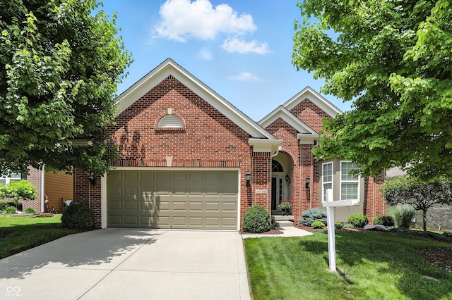 6570 Freemont Ln, Carmel, IN 46033 - traditional-style house featuring concrete driveway, a front lawn, and brick siding