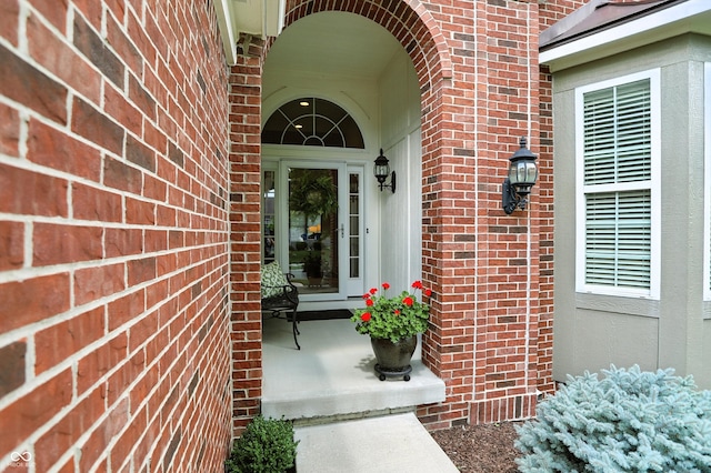 6570 Freemont Ln, Carmel, IN 46033 - view of exterior entry featuring brick siding and a porch