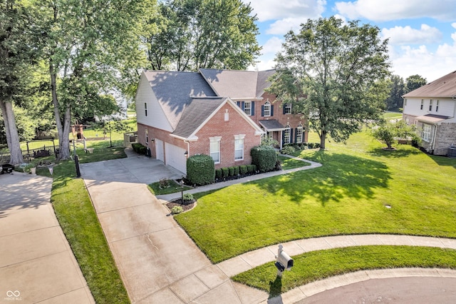 6374 Timberbluff Cir, Avon, IN 46123 - view of front of property with brick siding, an attached garage, and driveway