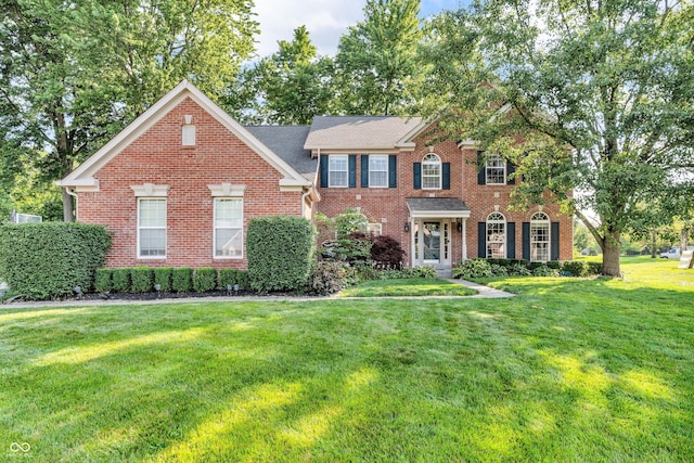 6374 Timberbluff Cir, Avon, IN 46123 - colonial-style house featuring brick siding and a front lawn