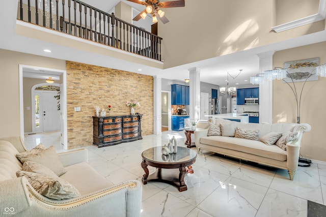 6374 Timberbluff Cir, Avon, IN 46123 - living area featuring a towering ceiling, light marble finish flooring, ornate columns, ceiling fan, and recessed lighting