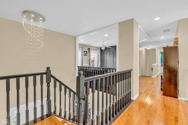 6374 Timberbluff Cir, Avon, IN 46123 - hallway with an upstairs landing, hardwood / wood-style floors, recessed lighting, and a chandelier