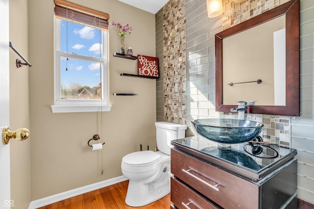 6374 Timberbluff Cir, Avon, IN 46123 - bathroom featuring wood finished floors, vanity, and decorative backsplash