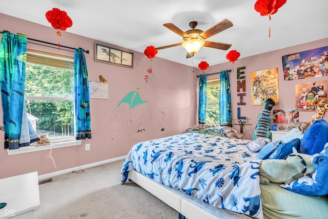 6374 Timberbluff Cir, Avon, IN 46123 - bedroom featuring multiple windows, carpet floors, and a ceiling fan