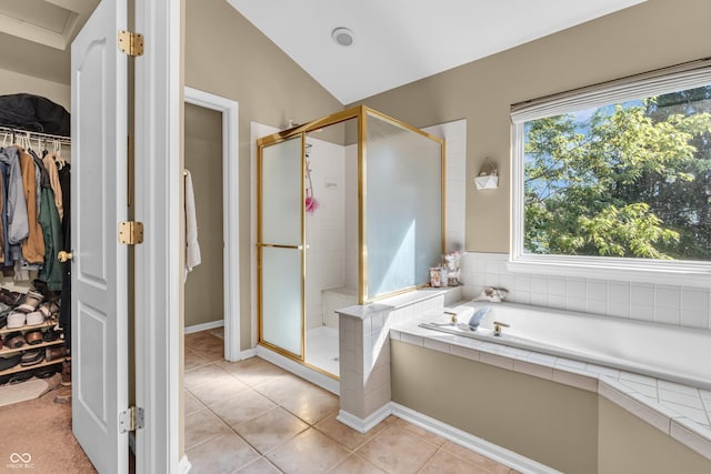 6374 Timberbluff Cir, Avon, IN 46123 - bathroom featuring a stall shower, a bath, a spacious closet, tile patterned floors, and lofted ceiling