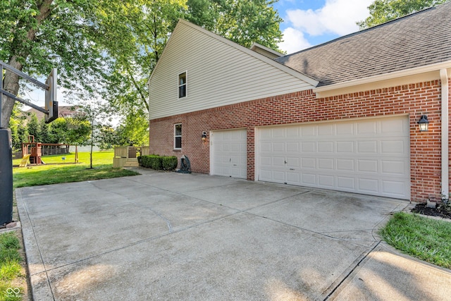 6374 Timberbluff Cir, Avon, IN 46123 - view of side of home featuring brick siding, driveway, a shingled roof, a lawn, and a garage