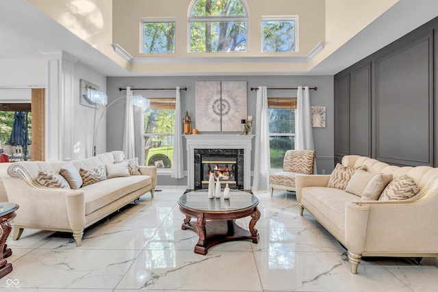 6374 Timberbluff Cir, Avon, IN 46123 - living area with plenty of natural light, light marble finish flooring, a premium fireplace, and a high ceiling