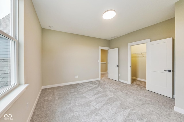 7604 Brownstone Ct, Greenfield, IN 46140 - unfurnished bedroom with carpet floors, a spacious closet, and a closet
